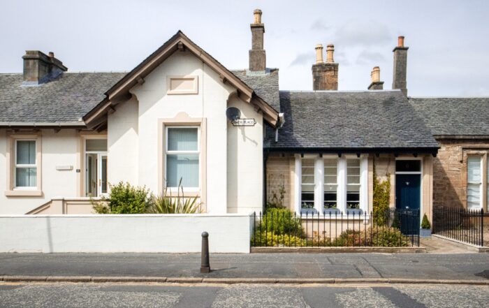 A white house which has had a RICS level 3 report.